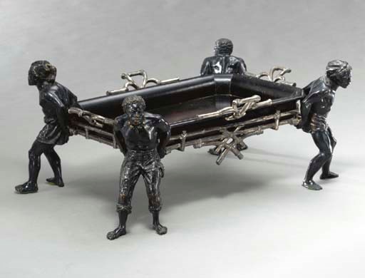 A FRENCH EBONIZED, SILVERED AND PARCEL-GILT-WOOD BLACKAMOOR TRAY ON STAND,