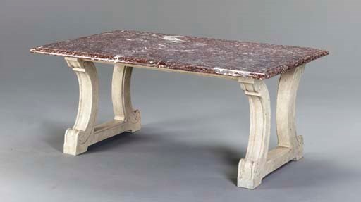 A RED LIVER MARBLE TABLE TOP ON SIMULATED STONE TRESTLE BASE,