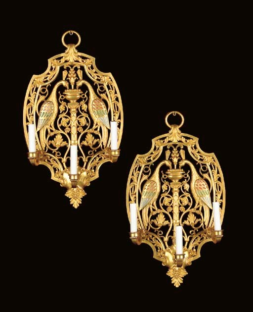 A PAIR OF AMERICAN ORMOLU AND POLYCHROME-DECORATED THREE-BRANCH WALL-LIGHTS