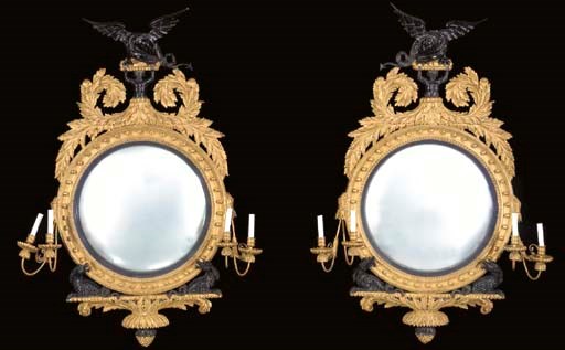 A PAIR OF LATE REGENCY STYLE GILT-WOOD AND EBONIZED CONVEX MIRRORS,
