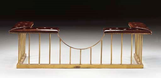 A BRASS AND LEATHER CLUB FENDER,