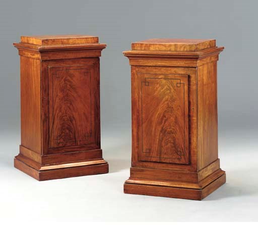A PAIR OF REGENCY EBONY-INLAID MAHOGANY PEDESTAL CABINETS,