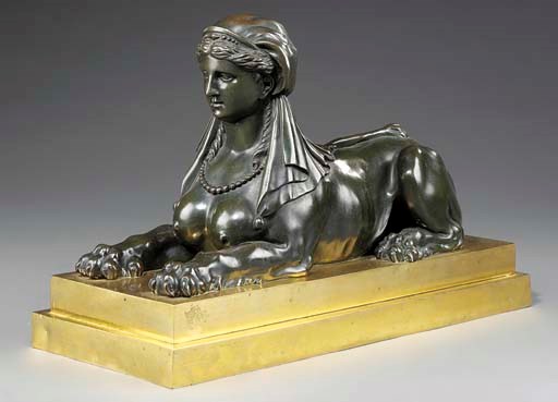 A Regency patinated-bronze sphinx