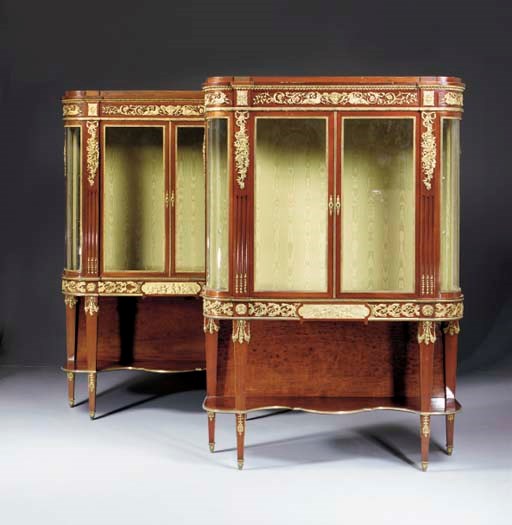 A Pair of French ormolu-mounted mahogany vitrines-on-stand