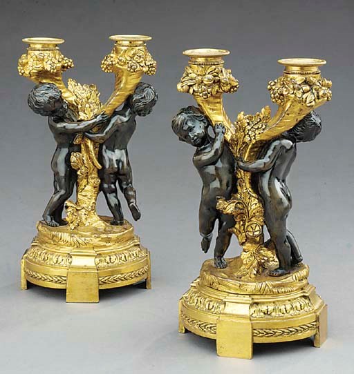 A pair of Napoleon III gilt- and patinated-bronze two-light figural candelabra