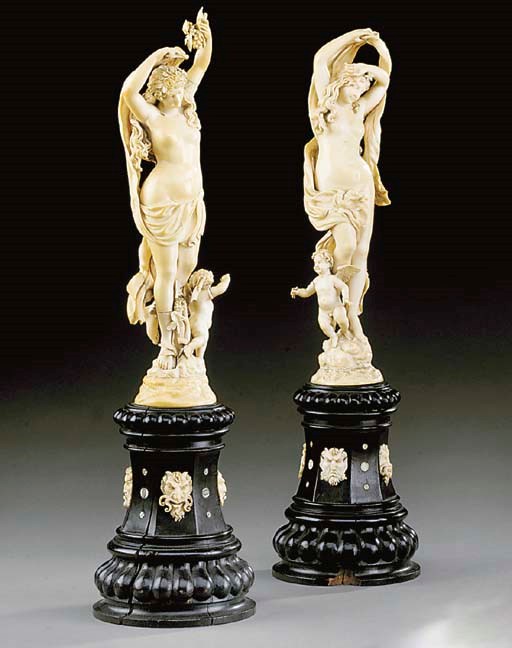 A pair of French carved-ivory figures emblematic of Night and Day