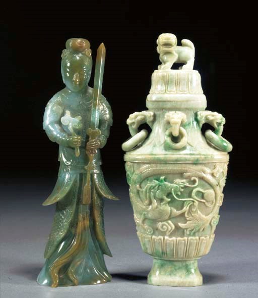 A CHINESE JADEITE MODEL OF A DEITY
LATE 19TH/EARLY 20TH CENTURY