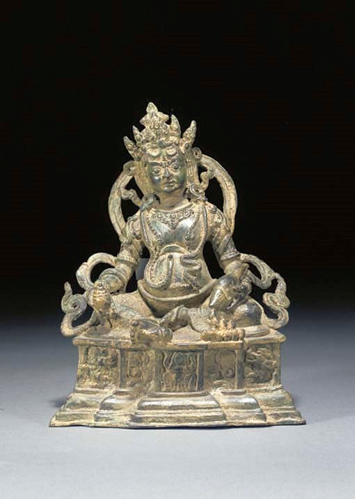 A NEPALESE BRONZE SEATED DEITY