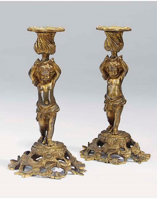 A pair of French gilt bronze figural candlesticks, third quarter 19th century