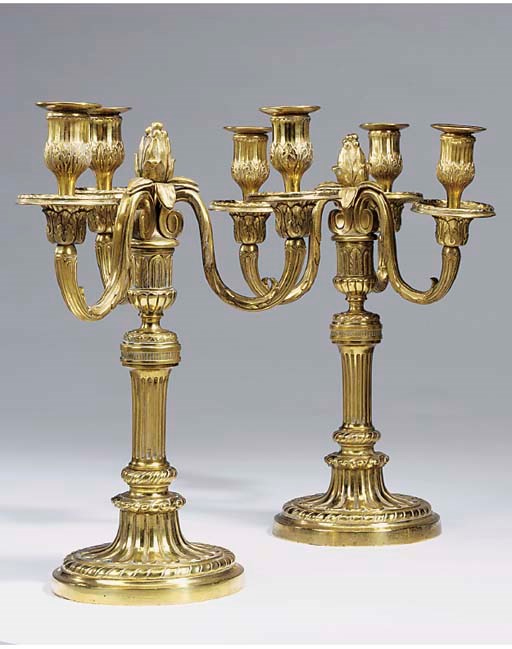 A pair of gilt bronze three light candelabra, first half 20th century