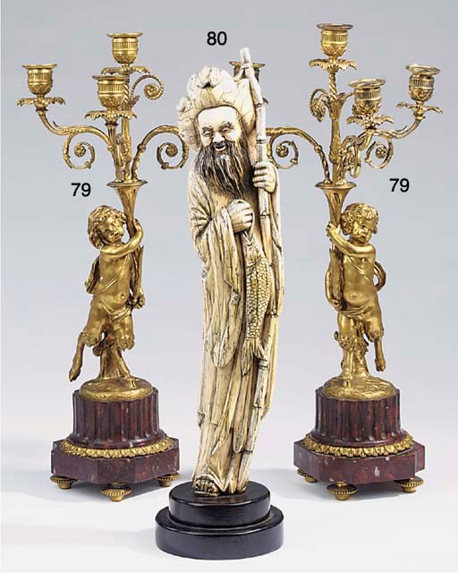 A Chinese carved ivory model of a fisherman, late 19th or early 20th century
