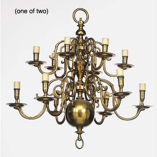 A near pair of Dutch style brass twelve light chandeliers, early 20th century