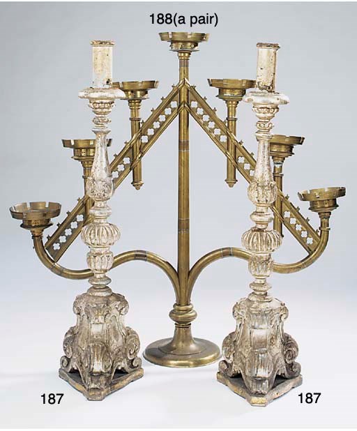 A pair of Italian carved and silvered wood floor standing altarsticks, late 19th century