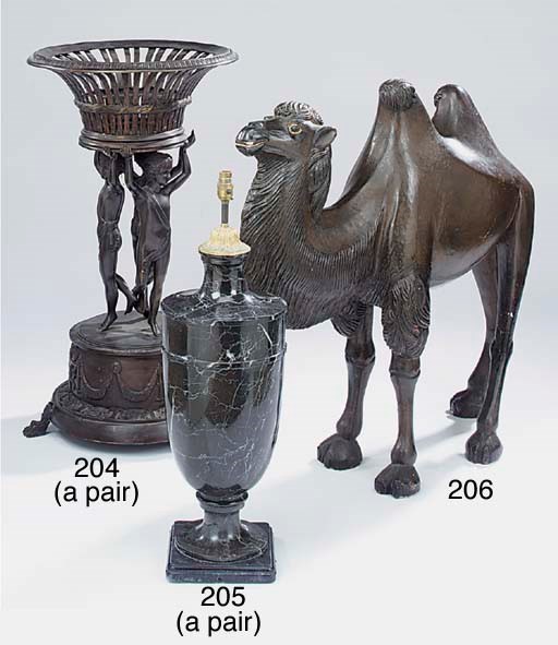 A pair of patinated metal figural jardiniere stands, 20th century