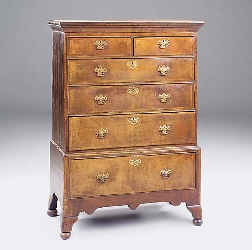 A walnut veneered and pine sided chest on stand, early 18th century