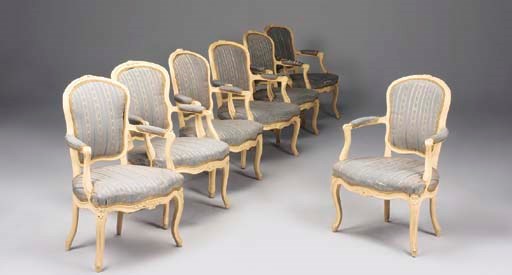 A MATCHED SET OF SIX LOUIS XV CREAM PAINTED FAUTEUILS