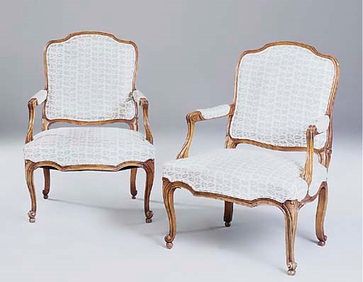 A pair of walnut fauteuils, 20th century, of Louis XV style