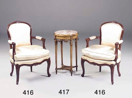 A pair of stained beech and upholstered fauteuils, mid 20th century