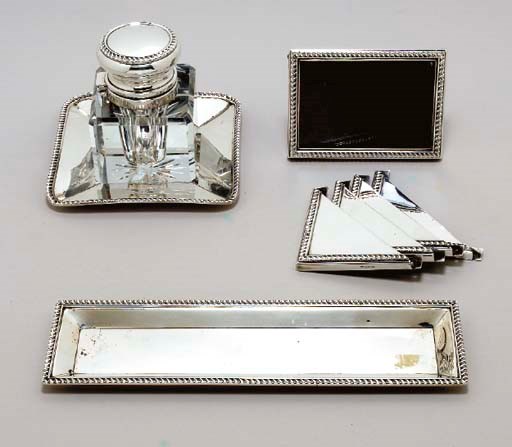 A CARTIER SILVER DESK SET,