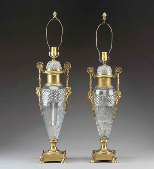 A pair of Empire style ormolu-mounted cut-glass two handled vases, mounted as lamps