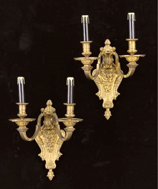 A set of four Louis XVI style twin-light wall appliques,