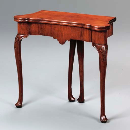 AN IRISH GEORGE II MAHOGANY GAMES TABLE,