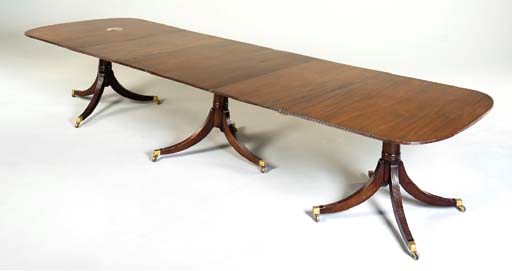 A MAHOGANY THREE-PEDESTAL DINING TABLE,