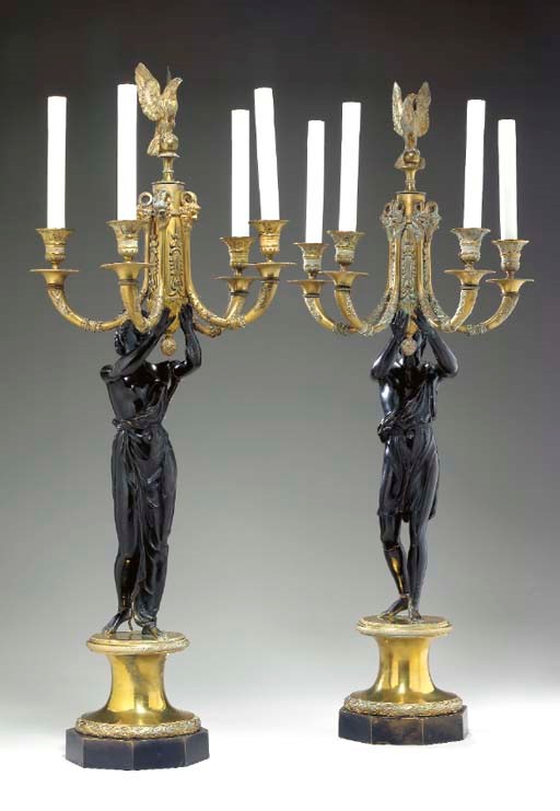 A PAIR OF EMPIRE STYLE GILT BRONZE AND PATINATED BRONZE FIGURAL FOUR-LIGHT CANDELABRA,