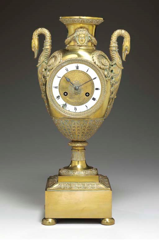 AN EMPIRE STYLE ORMOLU MANTEL CLOCK,