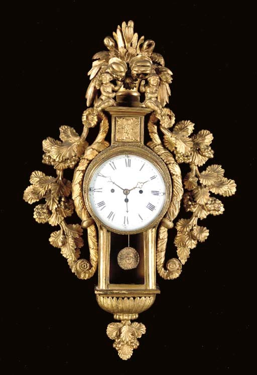 AN AUSTRIAN ROCOCO STYLE GILTWOOD CARTEL CLOCK,
