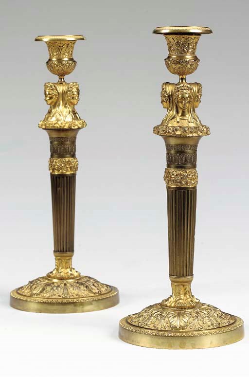 A PAIR OF EMPIRE STYLE ORMOLU CANDLESTICKS,