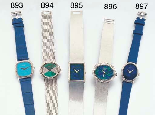 PIAGET. A LADY'S 18K WHITE GOLD AND DIAMOND-SET OVAL WRISTWATCH WITH BRACELET AND MALACHITE DIAL
