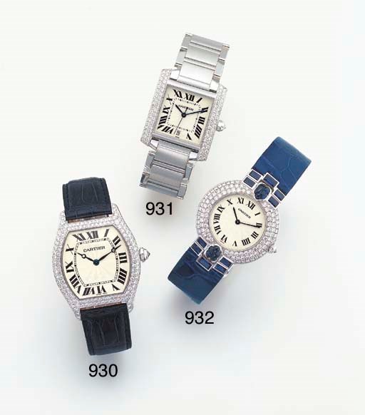 CARTIER. AN 18K WHITE GOLD AND DIAMOND-SET TONNEAU-SHAPED WRISTWATCH