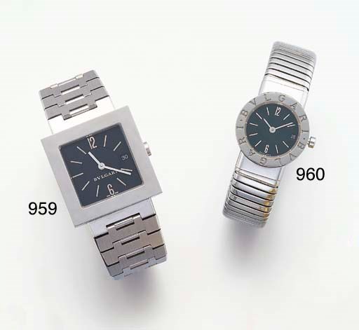 BULGARI. A LADY'S STAINLESS STEEL BANGLE-WATCH WITH DATE