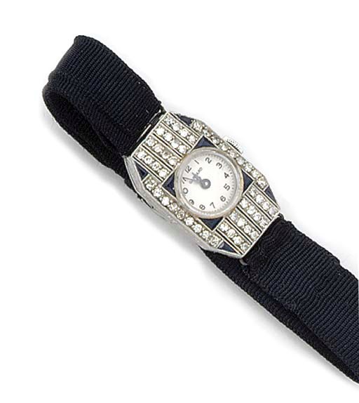 A lady's Art Deco diamond and sapphire wrist watch and a gold fob watch,