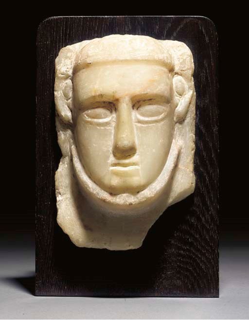 A SOUTH ARABIAN ALABASTER RELIEF MALE HEAD