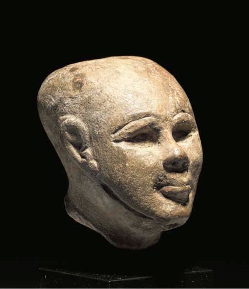 AN EGYPTIAN LIMESTONE HEAD OF PTAH(?)