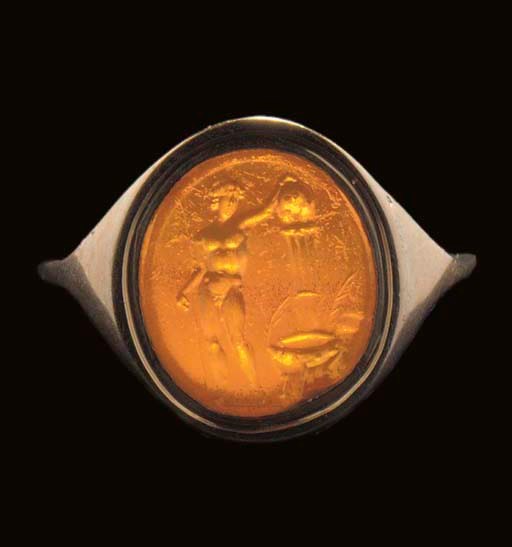 A GRAECO-ROMAN CORNELIAN INTAGLIO OF A VICTORIOUS ATHLETE