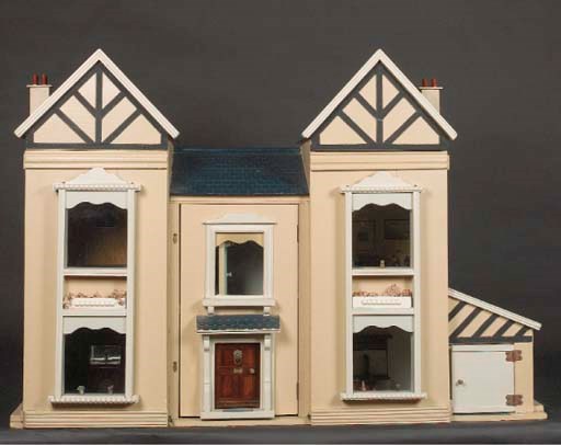 A painted wooden dolls' house