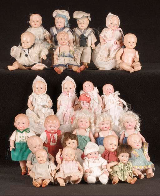 A quantity of celluloid dolls' house dolls