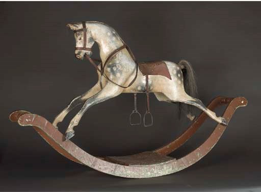 A G & J. Lines carved wooden rocking horse