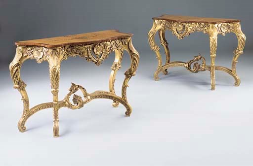 A pair of giltwood and painted satinwood serpentine console tables
of recent manufacture