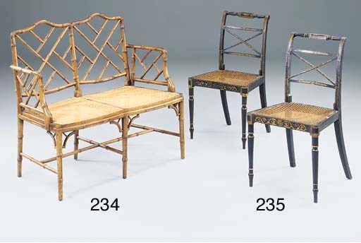 A PAIR OF REGENCY BLACK AND GILT DECORATED AND CANED SIDE CHAIRS