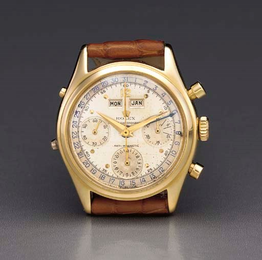 Rolex. A fine and rare 18K gold water-resistant triple calendar chronograph wristwatch with two-tone dial