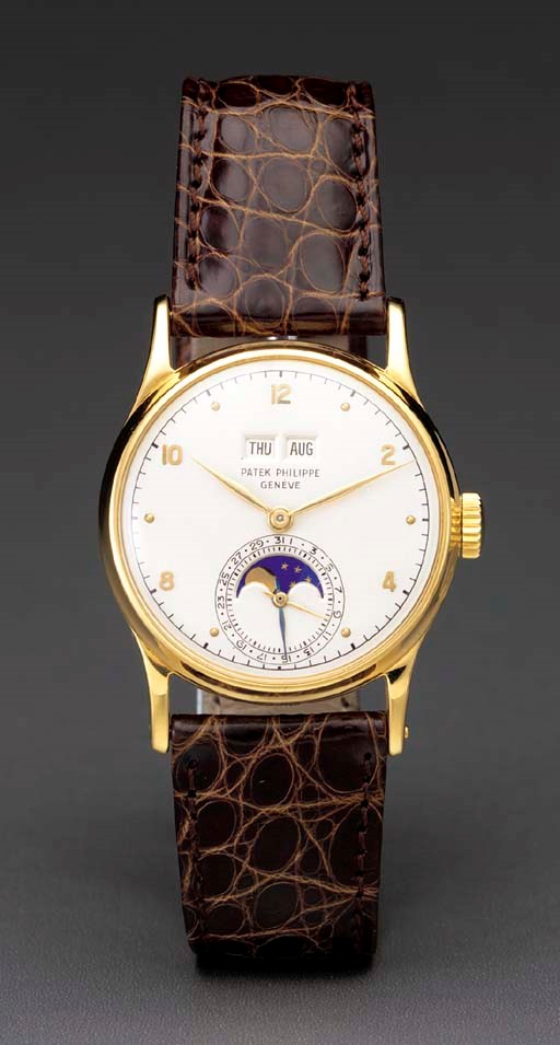 Patek Philippe. A fine and rare 18K gold perpetual calendar wristwatch with phases of the moon