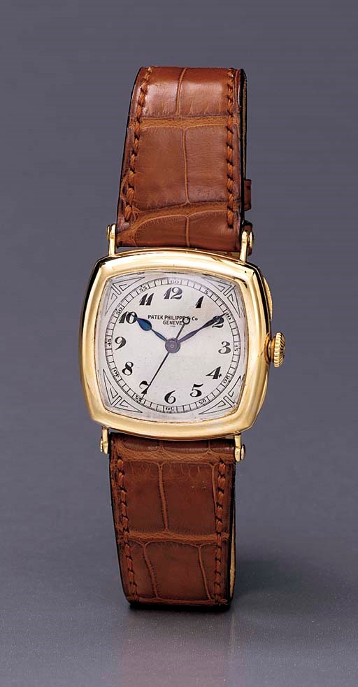 Patek Philippe. A fine and early 18K gold cushion-shaped wristwatch with sweep center seconds and Breguet numerals