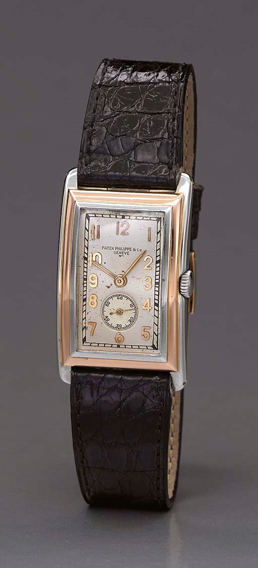 Patek Philippe. A fine and rare 18K two-colour gold oversized curved rectangular hinged wristwatch