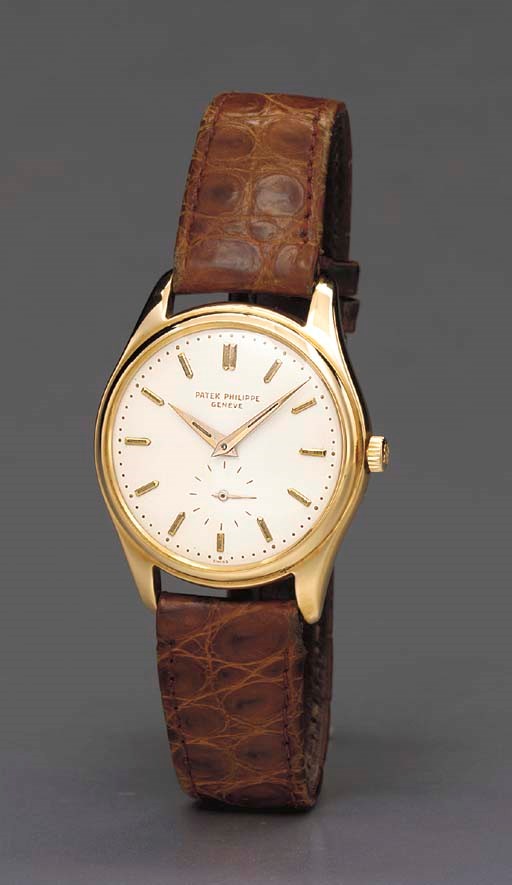 Patek Philippe. A fine and rare 18K gold self-winding water-resistant wristwatch with enamel dial and radium accents