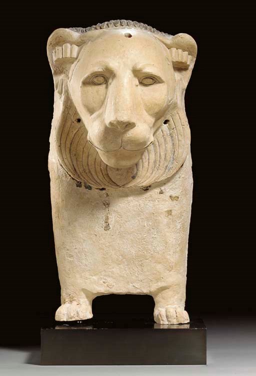 AN EGYPTIAN PLASTER LION