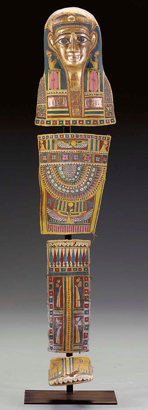 AN EGYPTIAN CARTONNAGE MUMMY SET